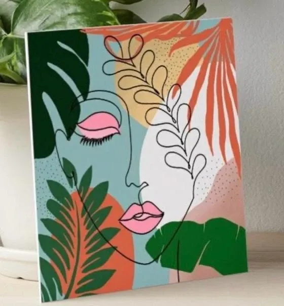 A boho line-art face among tropical leaves in green, coral and pink